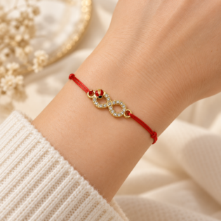 Brățară Handmade Cu Simbol Infinit, Cristale Și Buburuză Aurie Pe Șnur Roșu Reglabil – Noroc Infinit